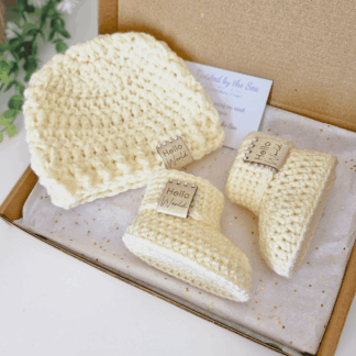 cream coloured hello World matching baby hat and bootie set