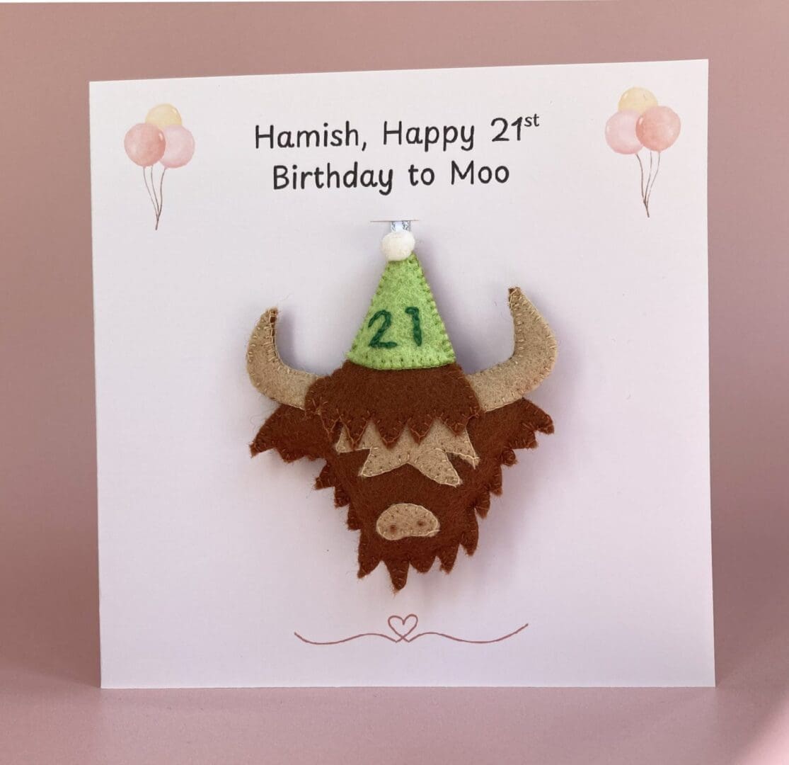 Highland cow birthday card with a felt handmade highland cow hanging decoration