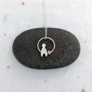 recycled sterling silver circle pendant with silver child and filled gold heart
