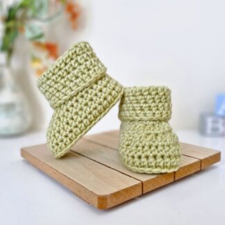 a pair of mushy Peas Green crochet baby booties, made-to-order in sizes newborn to 6 months with various Colours available