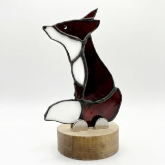 stained glass art fox on a wooden base