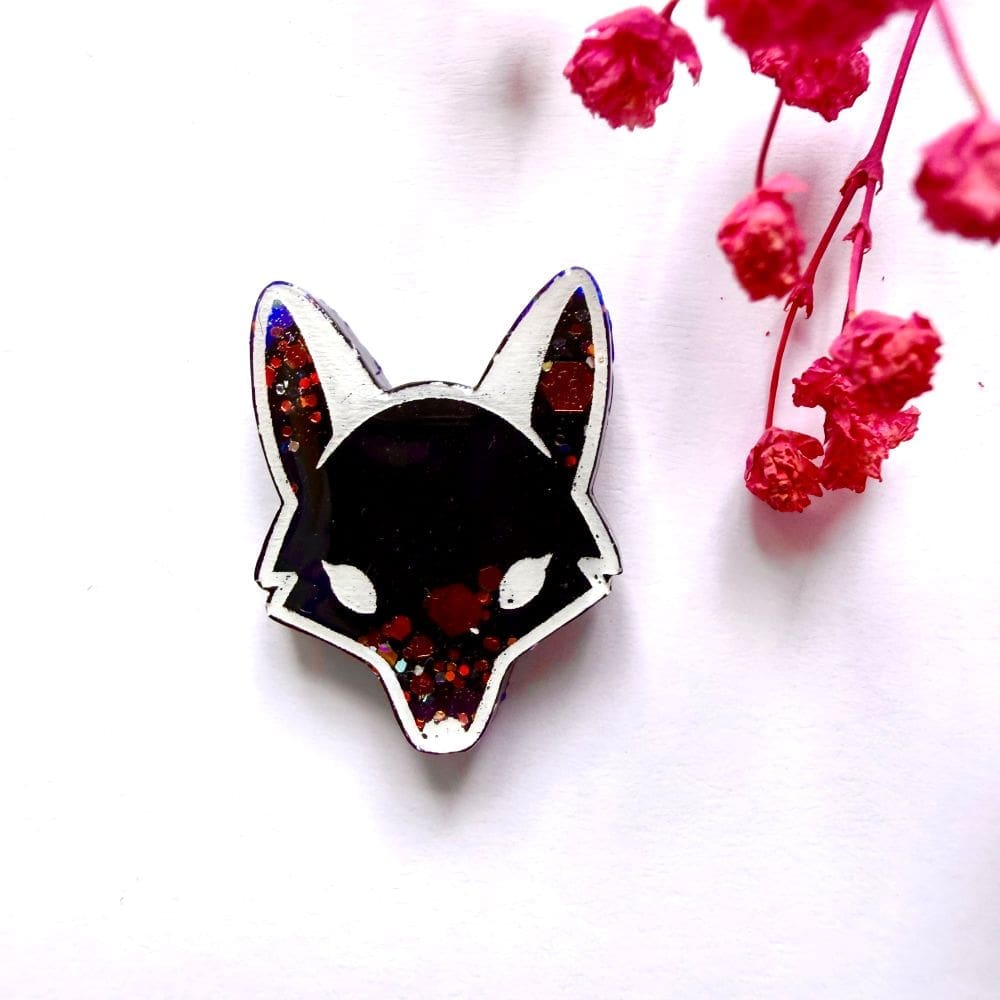 Dark shadow black resin fox pin badge with red glitter eyes handmade by Copper Magpie Designs Liverpool